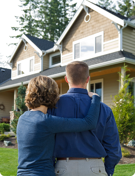 Homeowners outside their house